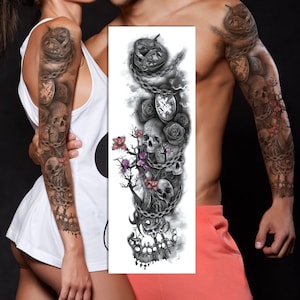 May include: A temporary tattoo design featuring a skull, flowers, and chains. The design is in black and gray with pink flowers. The tattoo is designed to be applied to the arm.