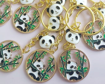 Panda keyring gold colour. Happy panda keychain eating bamboo or playing. Large & small charms on gold tone split keyring. Cute bear gift.