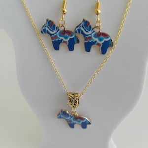 Dala horse jewellery. Red or blue on gold. Earrings or necklace. Traditional Swedish Dala Hästar, Dalarna, Sweden. Christmas nordic gift.
