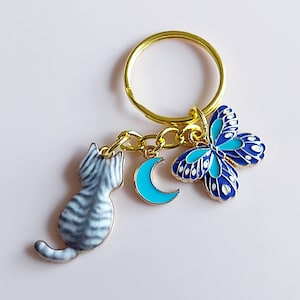 Silver tabby blue moon butterfly cat keyring. Grey cat chasing butterfly over the moon on a gold split keychain.  Cat lovers little keyring.