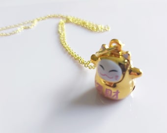 Fortune cat bell necklace. Gold tone lucky Japanese good luck 20 inch necklace. Maneki Neko copper gold-tone charm on gold plated chain.