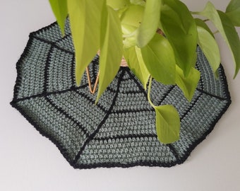 Spiderweb large crochet tablemat. Green and black handmade 17 inch (42cm) diameter Halloween doily made with acrylic aran wool.