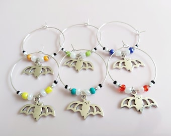 Halloween wine glass charms. Set of 6. Choose from bat, skull or pumpkin. Red, orange, yellow, turquoise, indigo, green beaded. Party fun.