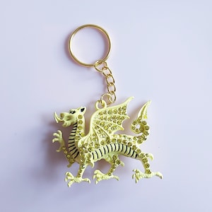 Gelber Rhinestone-Drache Keychain: Gold-Ton chinesischer Drache