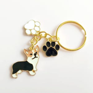 Corgi keyring. Cute dog keychain in gold tone with complementary paw print charms. Kawaii small gift for corgi fans. Puppy lovers present.