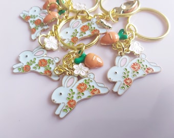 Flower bunny keyring. White floral rabbit with carrot and sakura charm on gold tone dual split keychain. Lovely happy bunny gift all year.