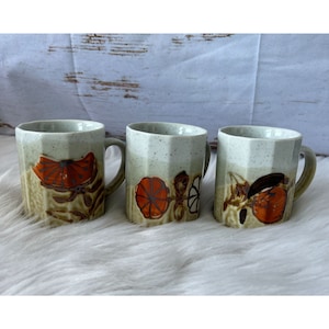 Set of 3 Vintage Japanese Stonewear Mugs, Earth tones with orange designs.