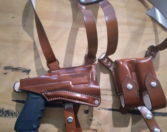 Shoulder Holster for Glock 17/22/31 with a tlr1 light w single mag and a Gerber MP600EOD multitool. right handed brown leather