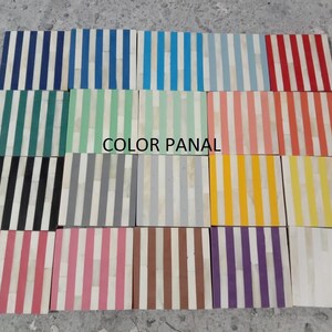 May include: A collection of 18 square bone inlay coasters with white stripes and various colored stripes. The colors include black, gray, teal, light green, light blue, blue, navy, light pink, orange, yellow, brown, purple, and red. The coasters are arranged in a grid pattern and the text "COLOR PANAL" is printed in the center of the image.