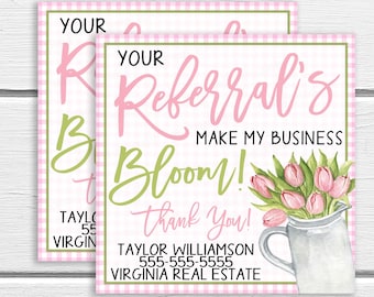 May include: Pink and green business card with a gingham background. The text reads "Your Referral's Make My Business Bloom! Thank You!" with a floral illustration of pink tulips in a white pitcher. The card also includes the text "Taylor Williamson 555-555-5555 Virginia Real Estate."