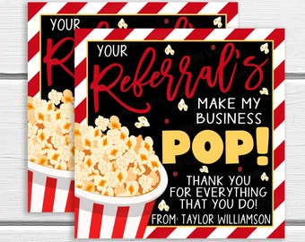 May include: Red and white striped thank you card with the text "Your Referral's Make My Business Pop! Thank You For Everything That You Do! From Taylor Williamson". The card features a black background with white popcorn in a red and white striped bucket.