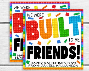 May include: A Valentine's Day card with a colorful Lego brick design. The card says "We were built to be friends!" and "Happy Valentine's Day! From: Janell Williamson".