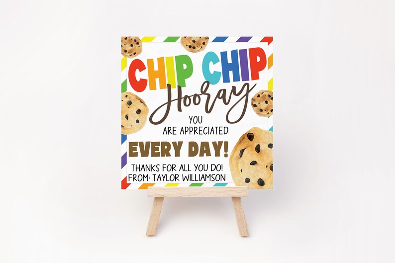 May include: A white card with a rainbow striped border and a message that says "Chip Chip Hooray You Are Appreciated Every Day! Thanks for all you do! From Taylor Williamson". The card is decorated with chocolate chip cookies.