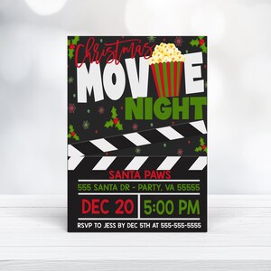 May include: Christmas Movie Night invitation with a black background, red and green holly, a popcorn bucket, and a movie clapperboard. The text reads "Christmas Movie Night", "Santa Paws", "555 Santa Dr - Party, VA 55555", "Dec 20 5:00 PM", and "RSVP to Jess by Dec 5th at 555-555-5555".
