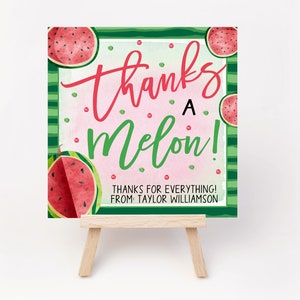 May include: A pink and green card with a watermelon design and the text "Thanks a Melon! Thanks for everything! From: Taylor Williamson".
