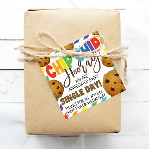 May include: A colorful gift tag with a cookie design and the text "CHIP Hooray You are appreciated every single day! Thanks for all you do! From Taylor Williamson."