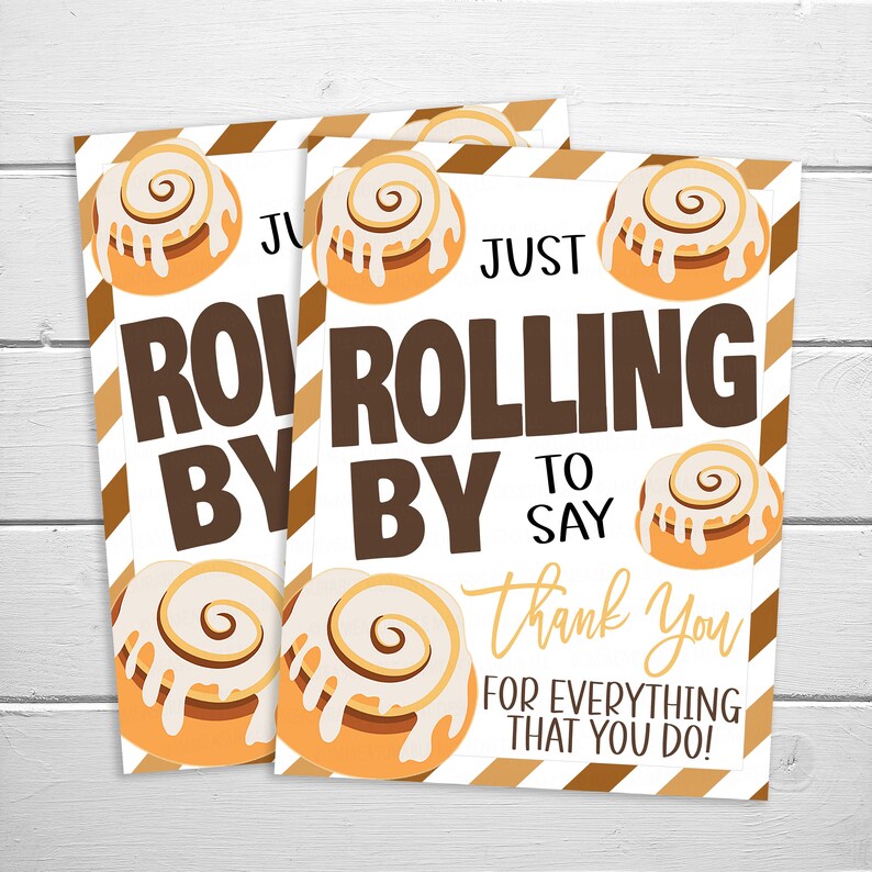 May include: A white card with brown stripes and a cinnamon roll design. The card says "Just rolling by to say thank you for everything that you do!"