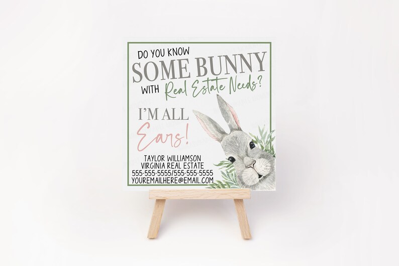 May include: A white card with a cartoon bunny peeking out from behind green leaves. The text on the card reads "Do you know some bunny with real estate needs? I'm all ears!" with contact information for Taylor Williamson, Virginia Real Estate.