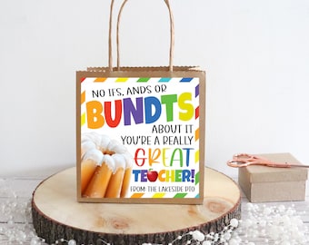 May include: A brown paper gift bag with a colorful printed tag that says "No ifs, ands or bundts about it you're a really great teacher!" with a picture of a bundt cake. The tag also says "From: The Lakeside PTO".