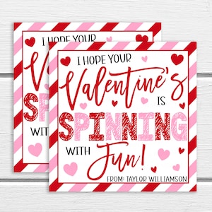 May include: Red and pink striped Valentine's Day card with the text "I hope your Valentine's is spinning with fun!" and "From: Taylor Williamson".