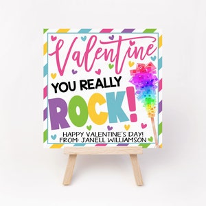 May include: A Valentine's Day card with a colorful rock candy design and the text "Valentine You Really Rock! Happy Valentine's Day! From: Janell Williamson"