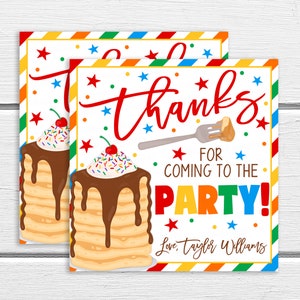 May include: Two square party favor cards with a white background. The cards feature a stack of pancakes with chocolate syrup and sprinkles, and the words "Thanks for coming to the party!" in red, orange, blue, and green.