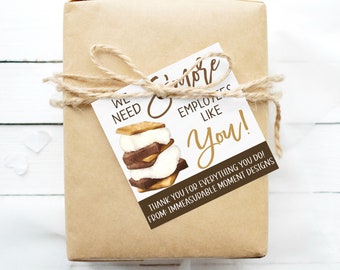 May include: A white gift tag with a watercolour illustration of a s'more. The tag reads "We need more employees like you!" and "Thank you for everything you do! From: Immeasurable Moment Designs."