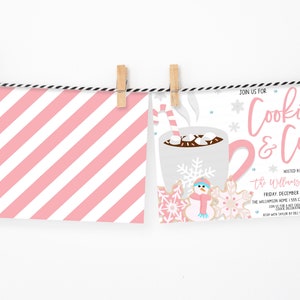 May include: Pink and white striped card with a pink and white illustration of a mug of hot chocolate with marshmallows and a candy cane. The text on the card reads "Join us for Cookies & Cocoa Hosted by the Williamson Family Friday December 10th at 4pm The Williamson Home 1955 Cookie & Cocoa Lane Join us for a hot chocolate bar & cookie decorating table RSVP with your favorite cookie by Dec. 1st at 555-555-5555"