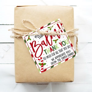 May include: A red and green striped gift tag with a candy cane and holly design. The tag says "You're the best! Thank you. So much for all that you do! We appreciate you! From: The Smith Family."