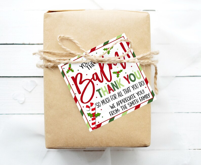 May include: A red and green striped gift tag with a candy cane and holly design. The tag says "You're the best! Thank you. So much for all that you do! We appreciate you! From: The Smith Family."