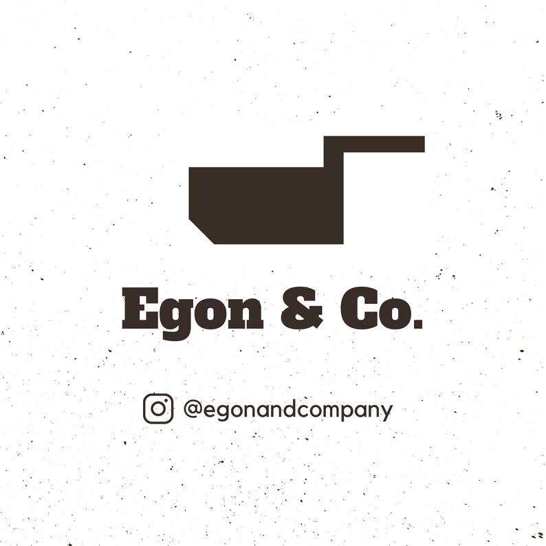 May include: Black and white logo for Egon & Co. with a stylized image of a small box with a handle. The text "Egon & Co." is below the image and the text "@egonandcompany" is below that.