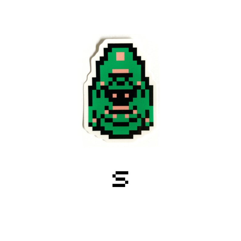 May include: Green pixel art sticker of a creature with a pink hat and black eyes. The sticker is on a white background.