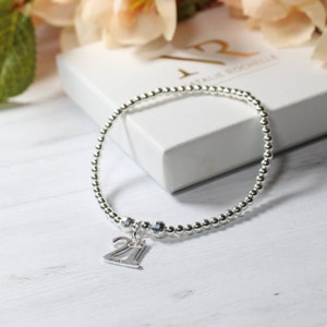 Sterling silver bracelet with 21st birthday charm
