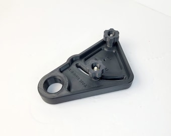 May include: Black plastic camera mount with two adjustable knobs and the text "VAK HOTKEY" printed on the side.