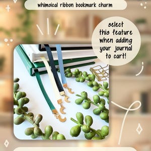 May include: Image of ribbon bookmarks with gold crescent moon charms. The bookmarks are in various colours, including green, black, and blue. The text on the image says "Optional whimsical ribbon bookmark charm".