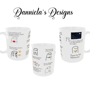 May include: White ceramic mugs with black line art and Spanish text. The mugs feature various illustrations of a stick figure with different expressions and phrases. The text includes phrases like "Eres mi razón, mi paz" and "Pues te las Merecías".