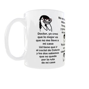 May include: White ceramic mug featuring a cartoon character with glasses and text in Spanish. The mug has a curved handle and a cylindrical shape. The text includes phrases like "Doctor, yo creo" and "mi casa."