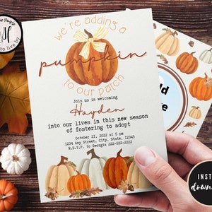 May include: A fall-themed adoption announcement card with a watercolor pumpkin illustration. The text reads "We're adding a pumpkin to our patch. Join us in welcoming Hayden into our lives in this new season of fostering to adopt. October 21, 2022 at 5 pm. 1234 Any Street, City, State, 12345. R.S.V.P. to Georgia 222-222-2222."