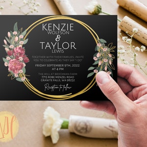 May include: Black wedding invitation with gold accents and floral illustrations. The invitation reads "Kenzie Wolfson & Taylor Lewis" and includes the date and location of the wedding.