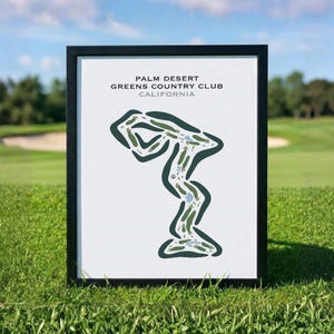 Può includere: Stampa incorniciata di una mappa del campo da golf. La mappa è un design stilizzato verde e bianco del Palm Desert Greens Country Club in California. La cornice è nera e la stampa è esposta su una superficie erbosa.