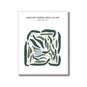 May include: A framed print showing a golf course layout. The design uses green and dark green shapes, with a blue water feature. The text "APACHE CREEK GOLF CLUB ARIZONA" is printed at the top of the image.