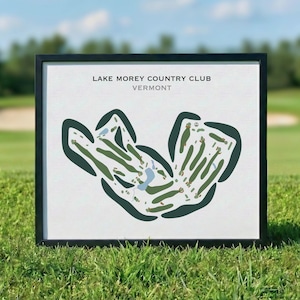 May include: A framed print featuring a stylized map of the Lake Morey Country Club in Vermont. The graphic displays dark green, light green, and blue shapes representing golf course fairways, greens, and water hazards on a white background.