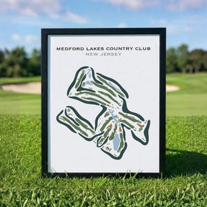 May include: A framed print featuring a stylized map of the Medford Lakes Country Club in New Jersey. The artwork displays the golf course layout in shades of green, tan, and light blue against a white background, enclosed in a black frame.
