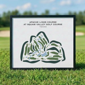 May include: A framed print featuring a stylised map of the Apache Links Course at Squaw Valley Golf Course in Texas. The graphic uses dark green shapes to represent fairways and bunkers, with a light blue winding path on a white background.