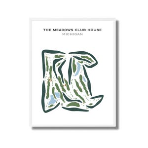 May include: A framed print showing a golf course layout. The map is in green, blue, and brown, with the text "THE MEADOWS CLUB HOUSE MICHIGAN" at the top. The map details the course's design, including fairways and water features.