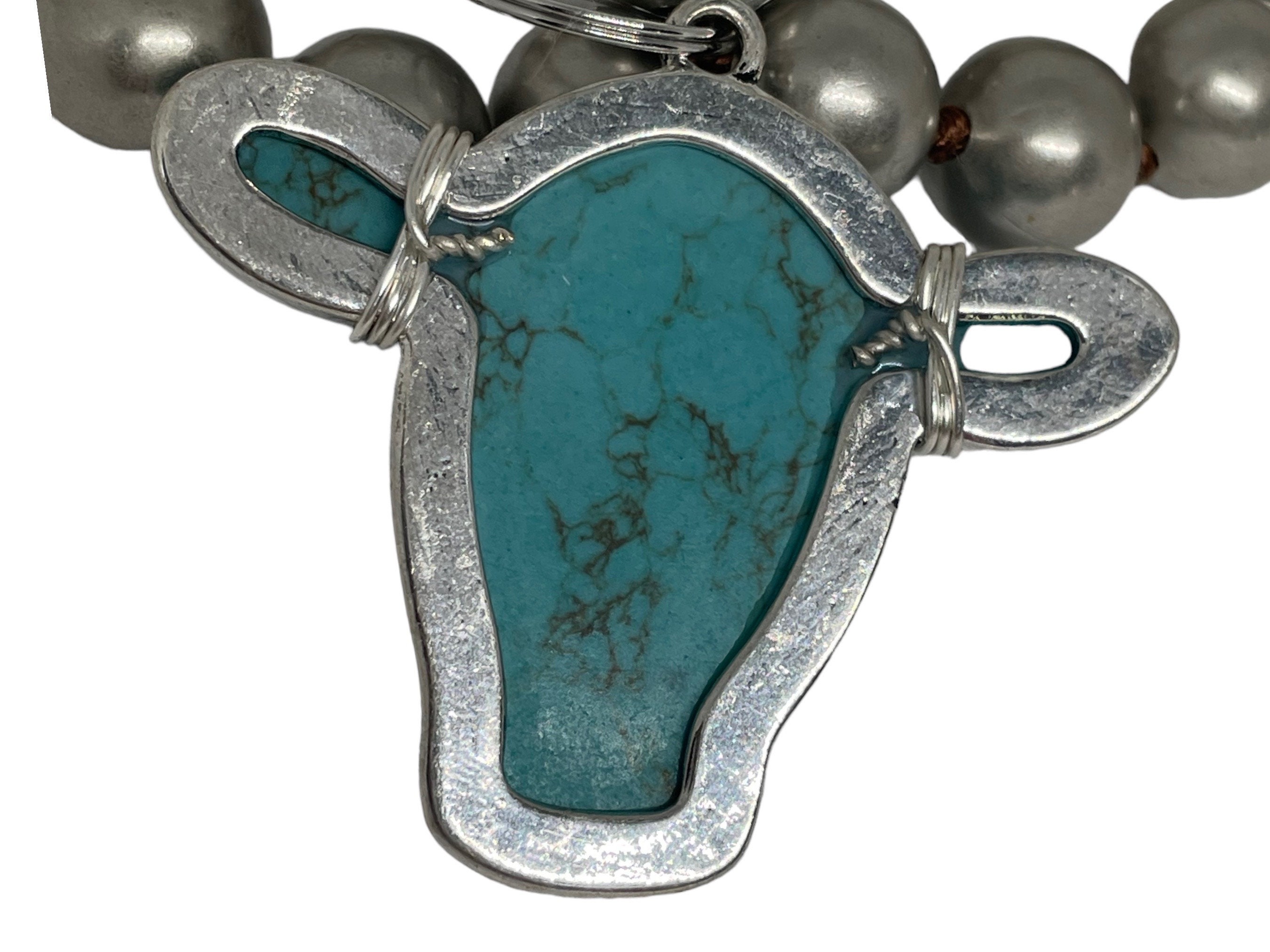 Turquoise Howlite Blue Cow Head Necklace With Silver Wire Wrap on