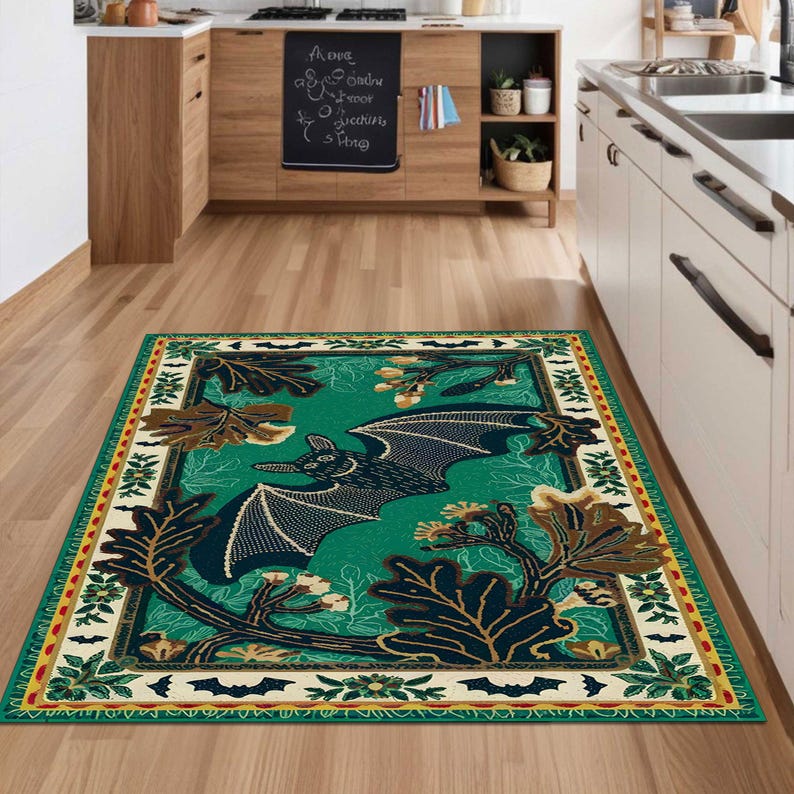 May include: A green and brown area rug with a black bat design and a white border. The rug has a repeating pattern of bats, leaves, and acorns.