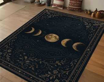 May include: A dark blue rug with a gold floral pattern and a crescent moon design. The rug features a repeating pattern of moons in different phases.
