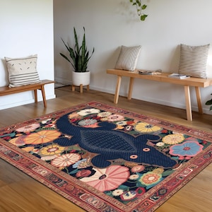 May include: A navy blue rug with a floral pattern and a large, stylized lizard in the center. The rug has a red, orange, and yellow border.