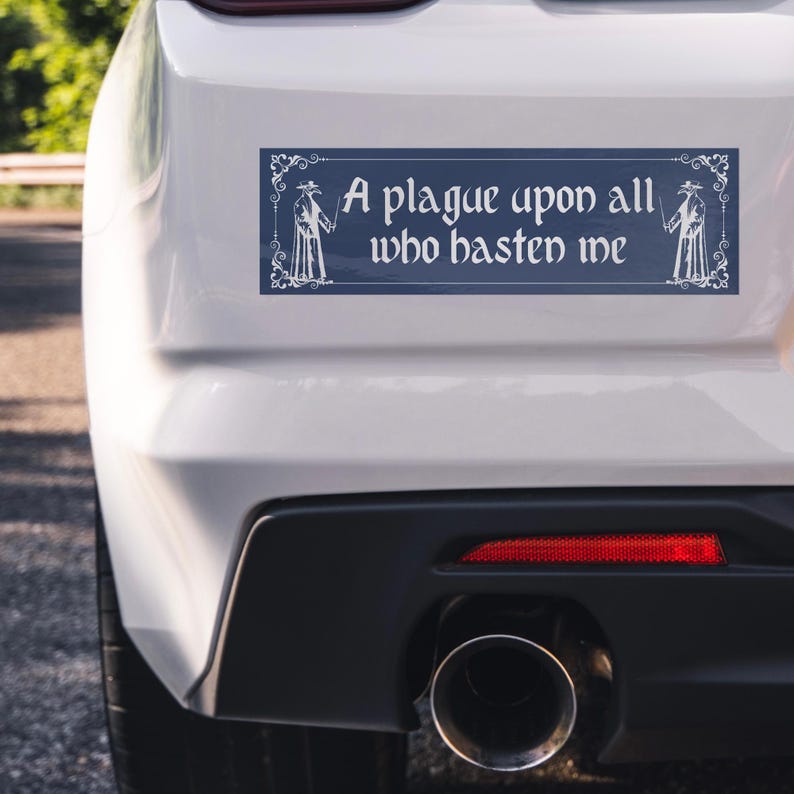 May include: A rectangular bumper sticker with a dark blue background and white text that reads A plague upon all who hasten me. The design features a white decorative border and a white illustration of a plague doctor on each side of the text.